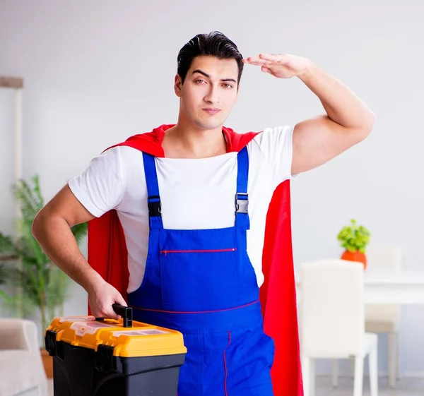Superhero repairman with tools in repair concept — Stock Photo, Image