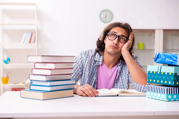 Young male student preparing for exams during Christmas — Stock Photo, Image