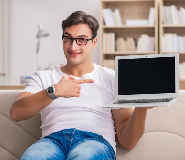 Man working sitting in couch sofa — Stock Photo, Image