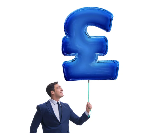 Businessman holding british pound sign inflatable balloon