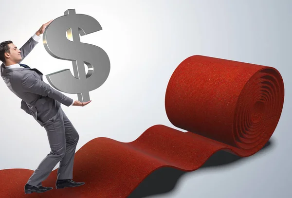 Empresario con dólares en alfombra roja —  Fotos de Stock