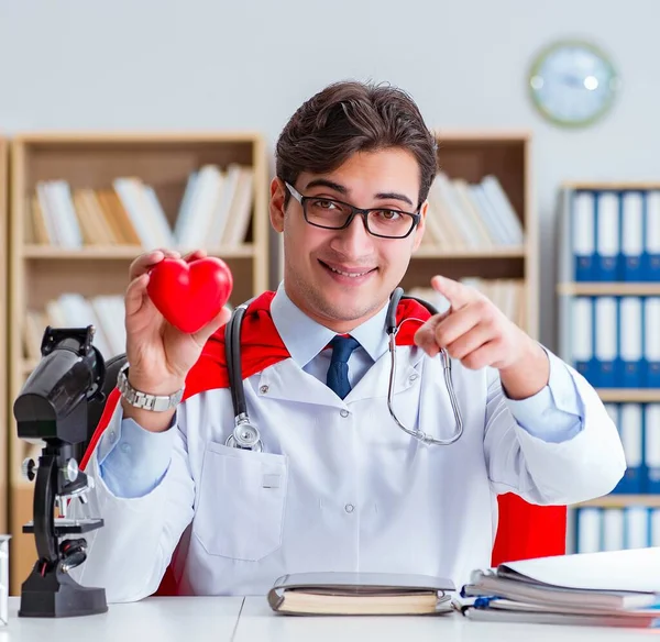 Superhero doctor working in the hospital lab