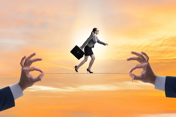 Businesswoman walking on tight rope — Stock Photo, Image