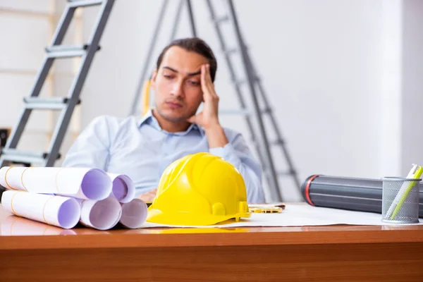 Young male architect working indoors — Stock Photo, Image