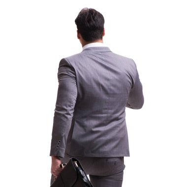 Businessman walking away isolated on white background clipart