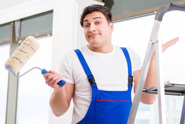 Painter repairman working at construction site — Stock Photo, Image