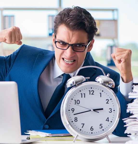Businessman with giant clock failing to meet deadlines and missi — Stock Photo, Image