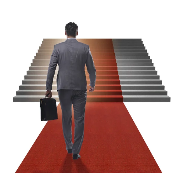 Joven empresario subiendo escaleras y alfombra roja sobre fondo blanco —  Fotos de Stock