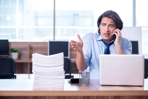 Young employee unhappy with excessive work