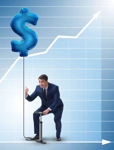 Affärsman pumpa dollartecken i affärsidé — Stockfoto