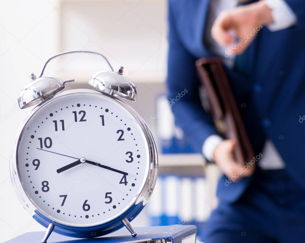 Businessman in rush trying to meet deadline