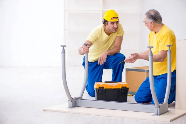 Two contractors carpenters working indoors — Stock Photo, Image