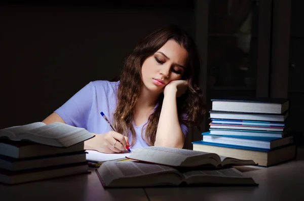 Young female student preparing for exams late at home — Stock Photo, Image