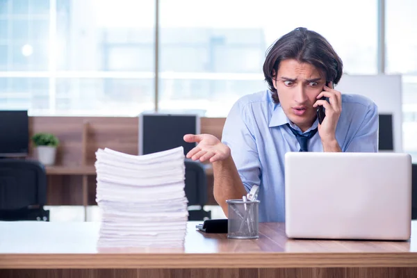 Young employee unhappy with excessive work