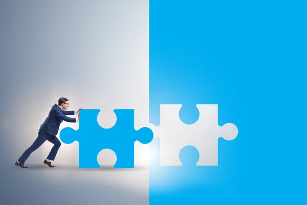 Concept of businessman with missing jigsaw puzzle piece — Stock Photo, Image
