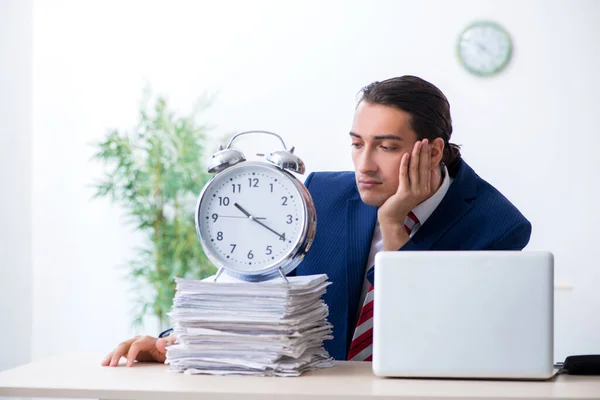 Young male businessman sitting in the office — Stock Photo, Image