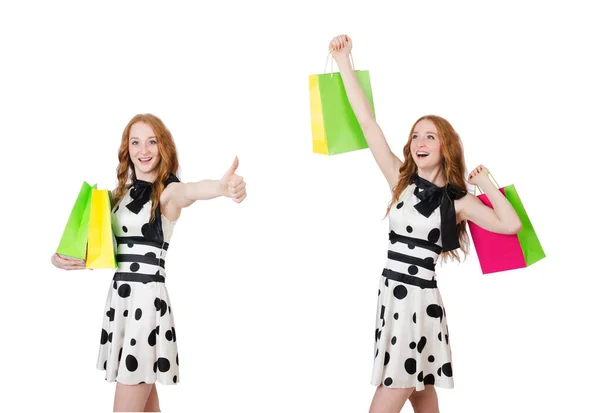 Jeune femme avec des sacs à provisions sur blanc — Photo