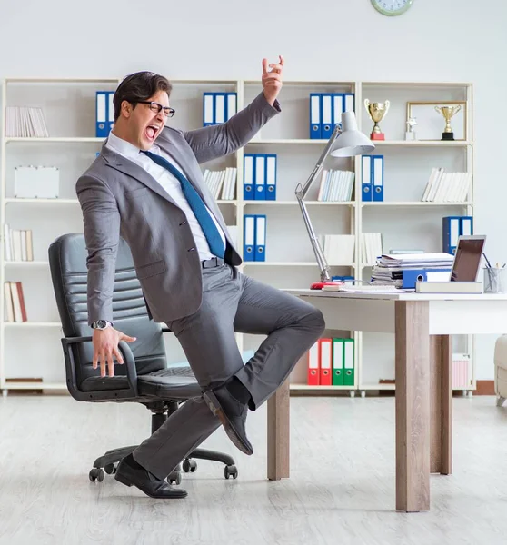 Businessman having fun taking a break in the office at work — Stock Photo, Image