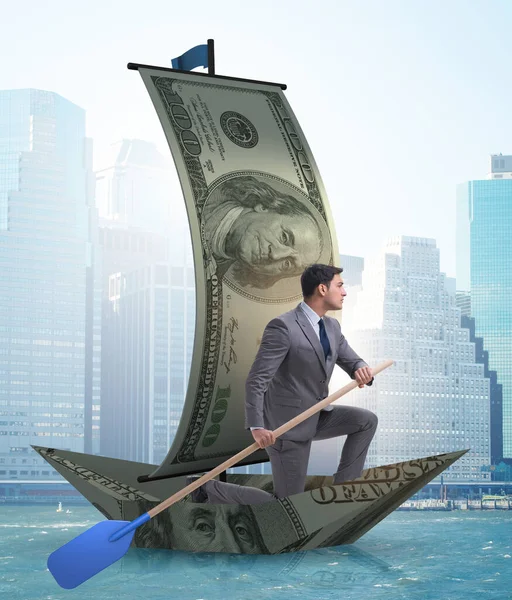 El hombre de negocios remando en el barco del dólar en el conc financiero de negocios — Foto de Stock