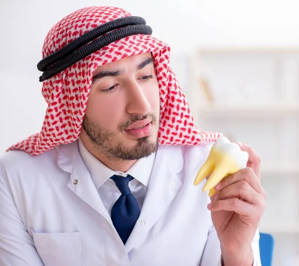 Arab dentist working on new teeth implant — Stock Photo, Image