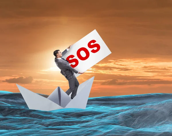 Businessman asking for help with SOS message on boat