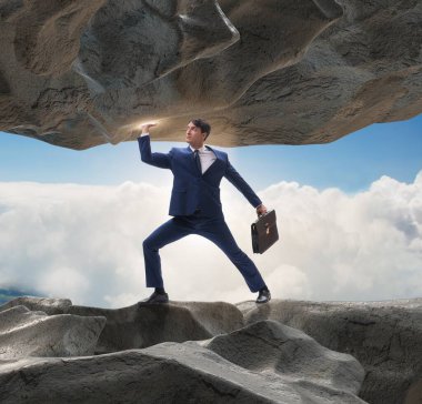 Baskı altında taşı destekleyen iş adamı