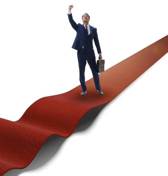 Az üzletember a vörös szőnyegen elszigetelt fehér háttér — Stock Fotó