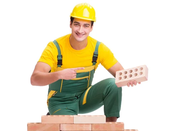 The handsome construction worker building brick wall — Stock Photo, Image