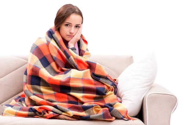 Teenager suffering from cold sitting on coach — Stock Photo, Image