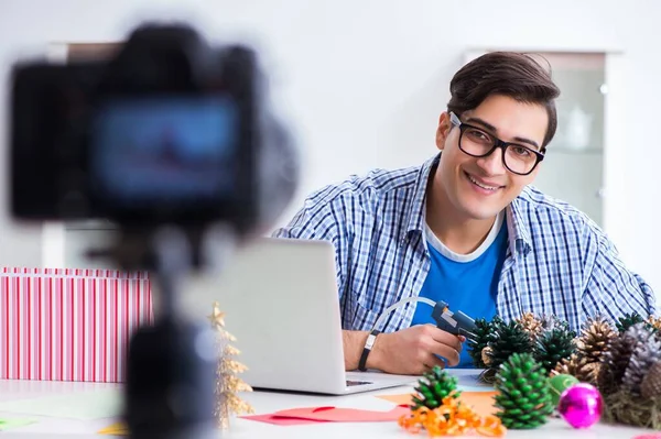 The young vlogger recording video doing christmas decoration — Stock Photo, Image