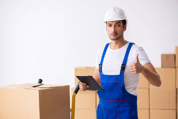 Young male professional mover doing home relocation
