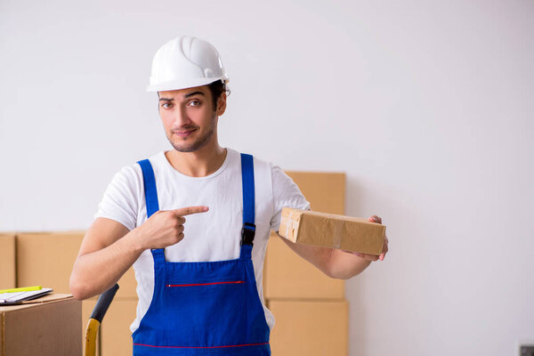 Young male professional mover doing home relocation