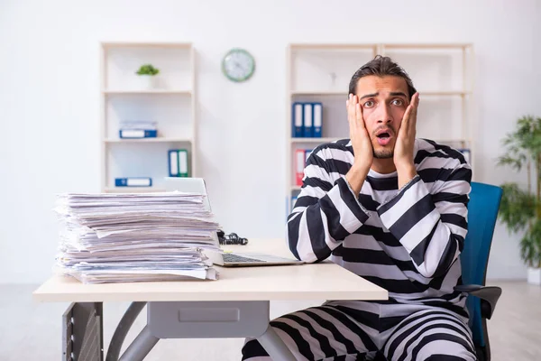 Young employee feeling like prisoner at work — Stock Photo, Image