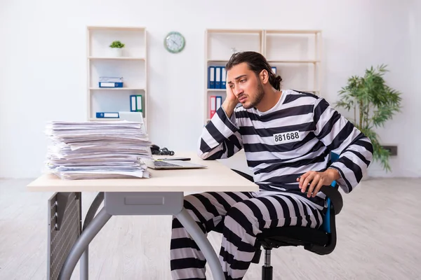 Young employee feeling like prisoner at work — Stock Photo, Image