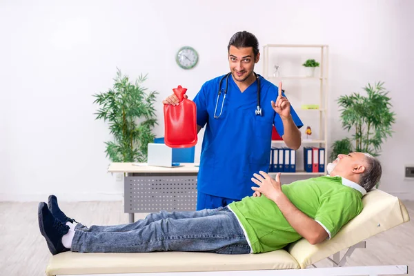 Old man visiting young male doctor gastroenterologist — Stock Photo, Image