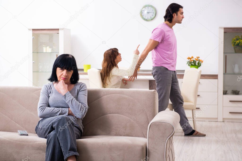 Young family and mother-in-law in family issues concept
