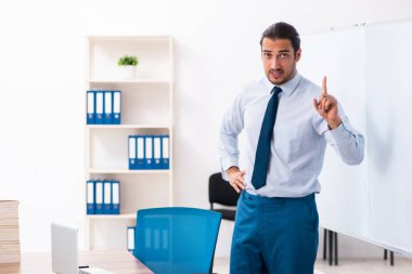 Young male employee in business presentation concept