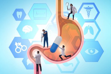 Doktorlar mide ve medikal konsepti inceliyor.