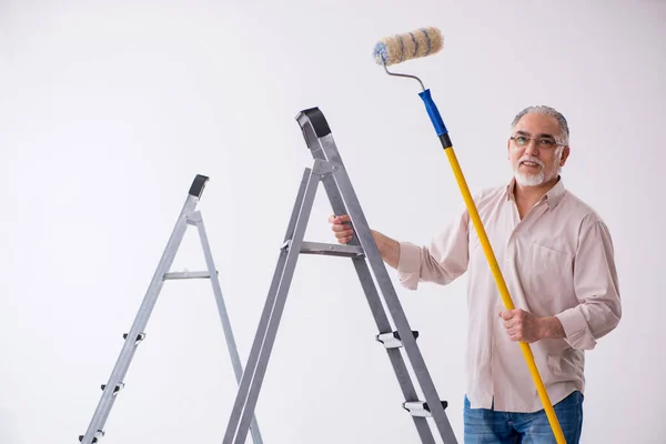 Old husband contractor in home renovation concept — Stock Photo, Image