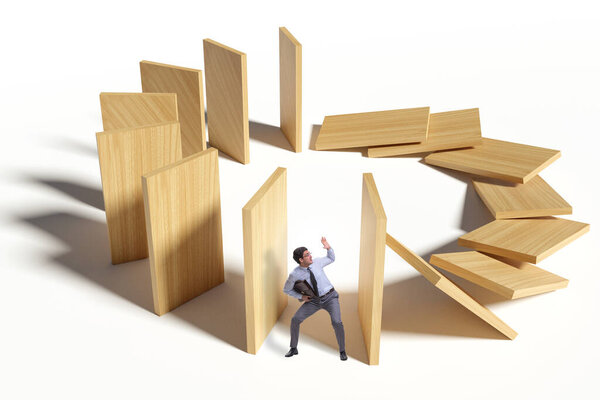 Бизнесмен в концепции эффекта домино
