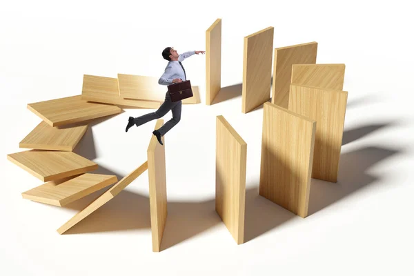 Zakenman in domino effect concept — Stockfoto