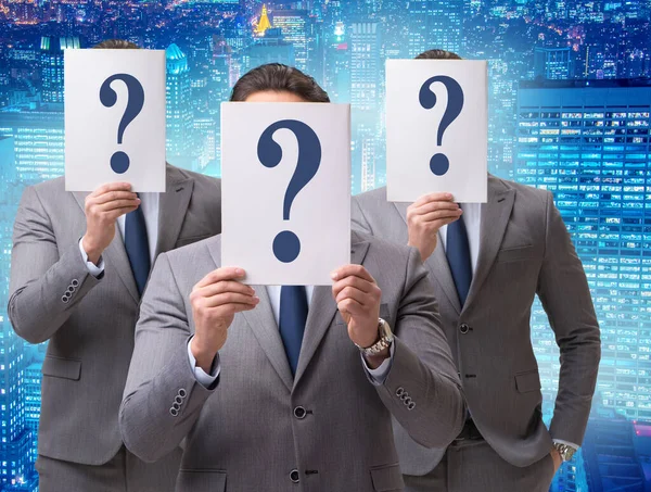 Businessman in uncertainty concept with question marks — Stock Photo, Image