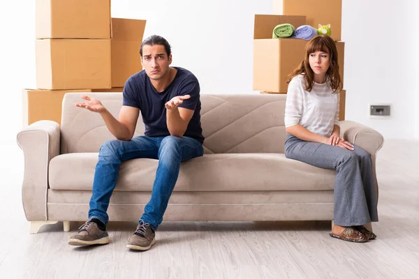 Young pair and many boxes in divorce settlement concept