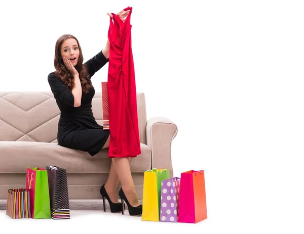 Mujer probando ropa nueva sentada en el sofá —  Fotos de Stock