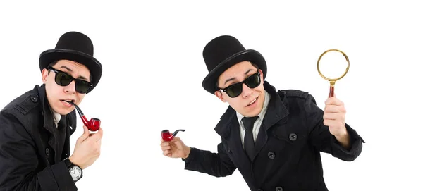 Young detective in black coat holding magnifying glass isolated — Stock Photo, Image