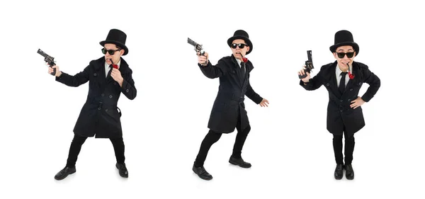 Junger Detektiv in schwarzem Mantel mit Handfeuerwaffe auf weißem Untergrund — Stockfoto