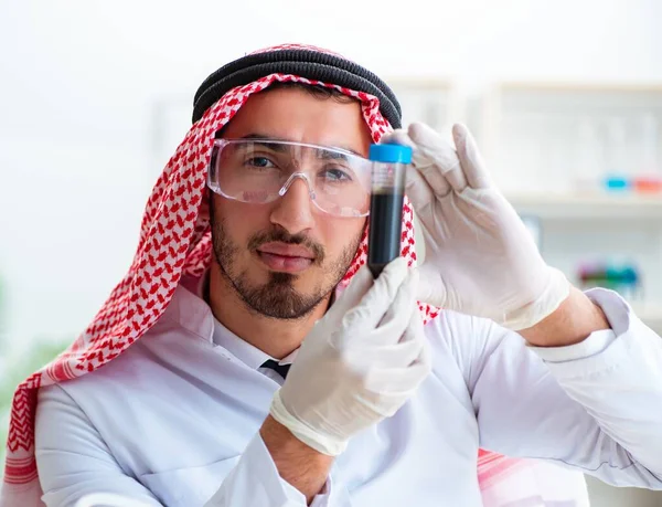 Arab chemist scientist testing quality of oil petrol — Stock Photo, Image