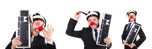 Funny clown with keyboard isolated on white — Stock Photo, Image