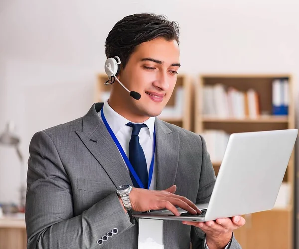 Handsome customer service clerk with headset — Stock Photo, Image