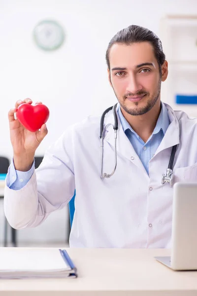 Young handsome male doctor working in the clinic — Stock Photo, Image